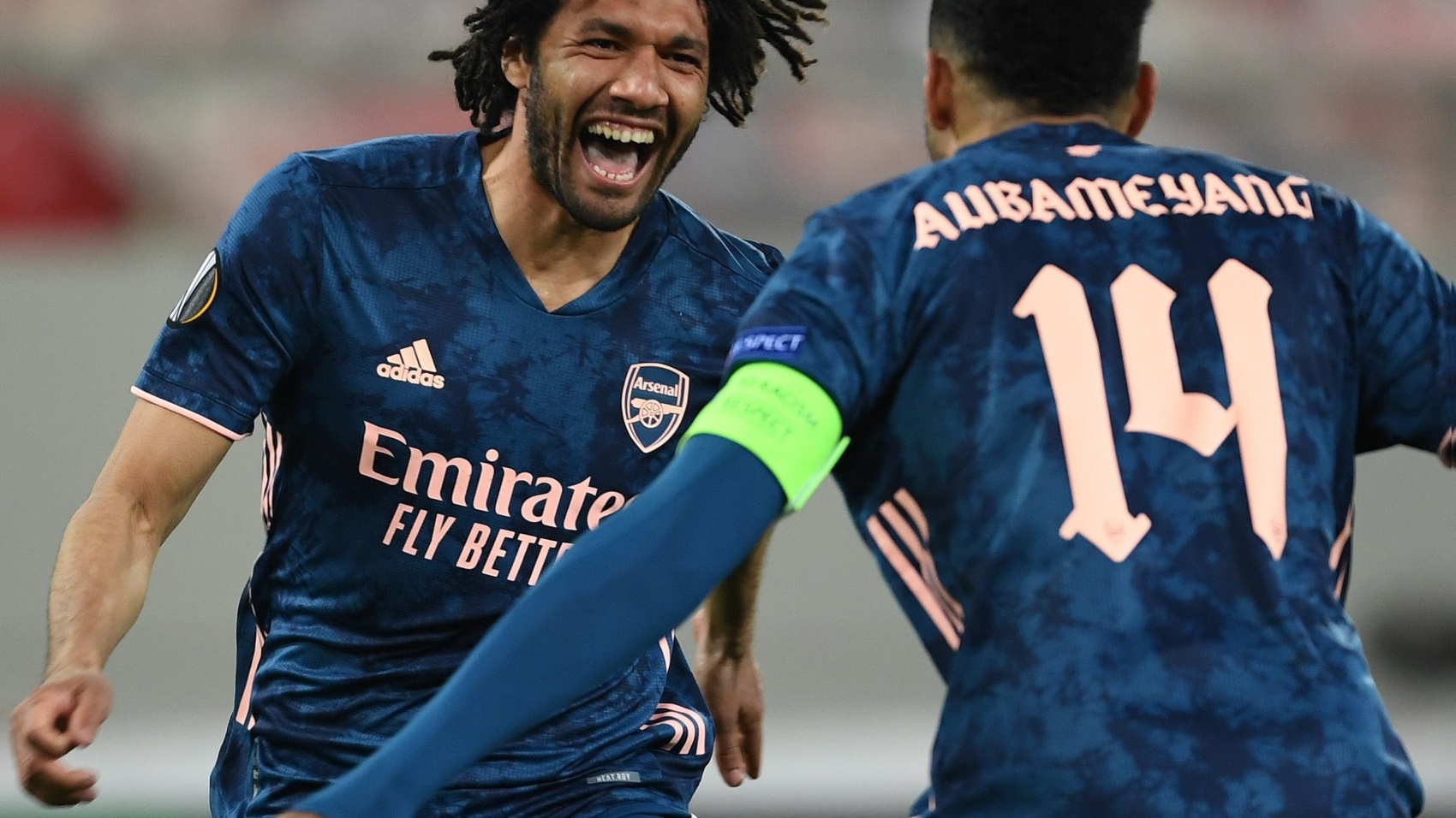 PIRAEUS, GREECE - MARCH 11: (L) Mo Elneny celebrates scoring the 3rd Arsenal goal with (R) Pierre-Emerick Aubameyang during the UEFA Europa League Round of 16 First Leg match between Olympiacos and Arsenal at Karaiskakis Stadium on March 11, 2021 in Piraeus, Greece. Sporting stadiums around Europe remain under strict restrictions due to the Coronavirus Pandemic as Government social distancing laws prohibit fans inside venues resulting in games being played behind closed doors. (Photo by Stuart MacFarlane/Arsenal FC via Getty Images)